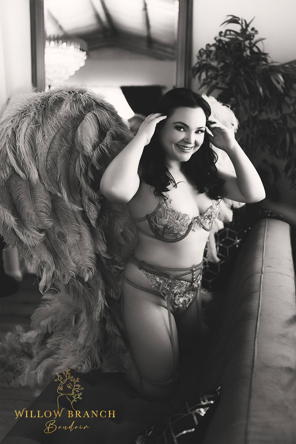 Upper Coomera boudoir glamour session with elegant posing and styling, woman in angel wings, photo in black and white